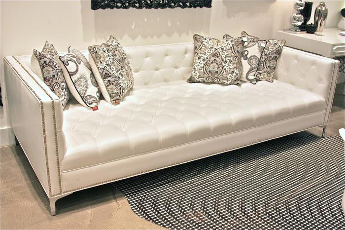 white faux leather tufted sofa